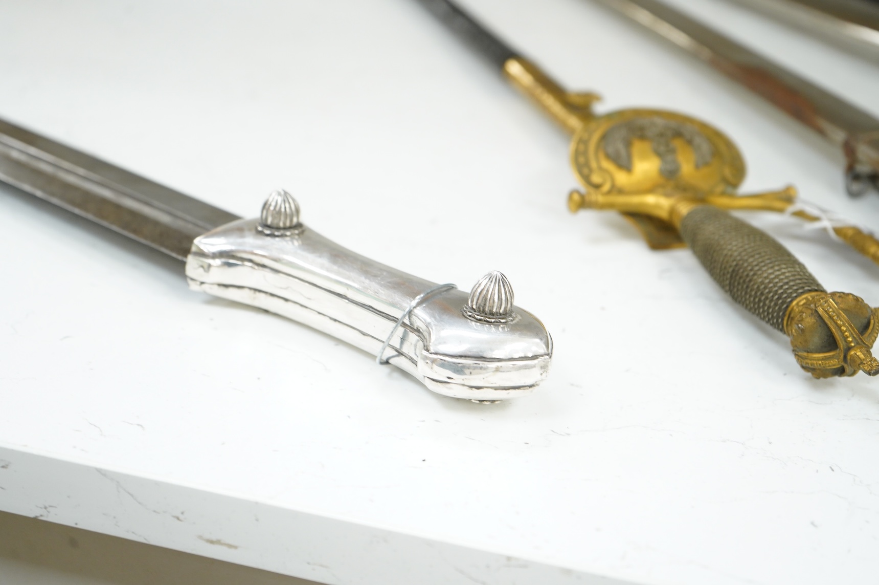 A late 19th century Ottoman Turkish dagger kindjal, blade 49cm, plain silver handle with decorative rivet heads